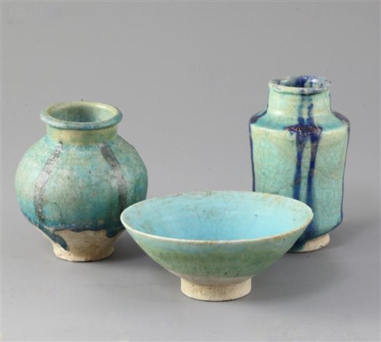 A Kashan turquoise glazed pottery bowl and two similar small jars, 13th century, 9.7 - 11.5cm, some restorations